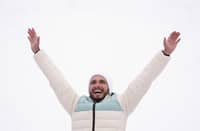 Silver medallist Individual Neutral Athletes' Nikita Filippov celebrates on the podium after competing in the men's sprint ski mountaineering event during the Milano Cortina 2026 Winter Olympic Games at the Stelvio Ski Centre in Bormio (Valtellina) on February 19, 2026.