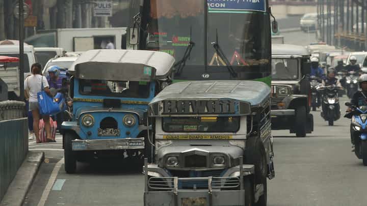 Public utility jeepneys ply their route along Quezon Boulevard. Transport group Pasang Masda is petitioning for a one-peso provisional fare hike following successive oil price increases, while the Land Transportation Franchising and Regulatory Board prepares to conduct public consultations on the proposal.