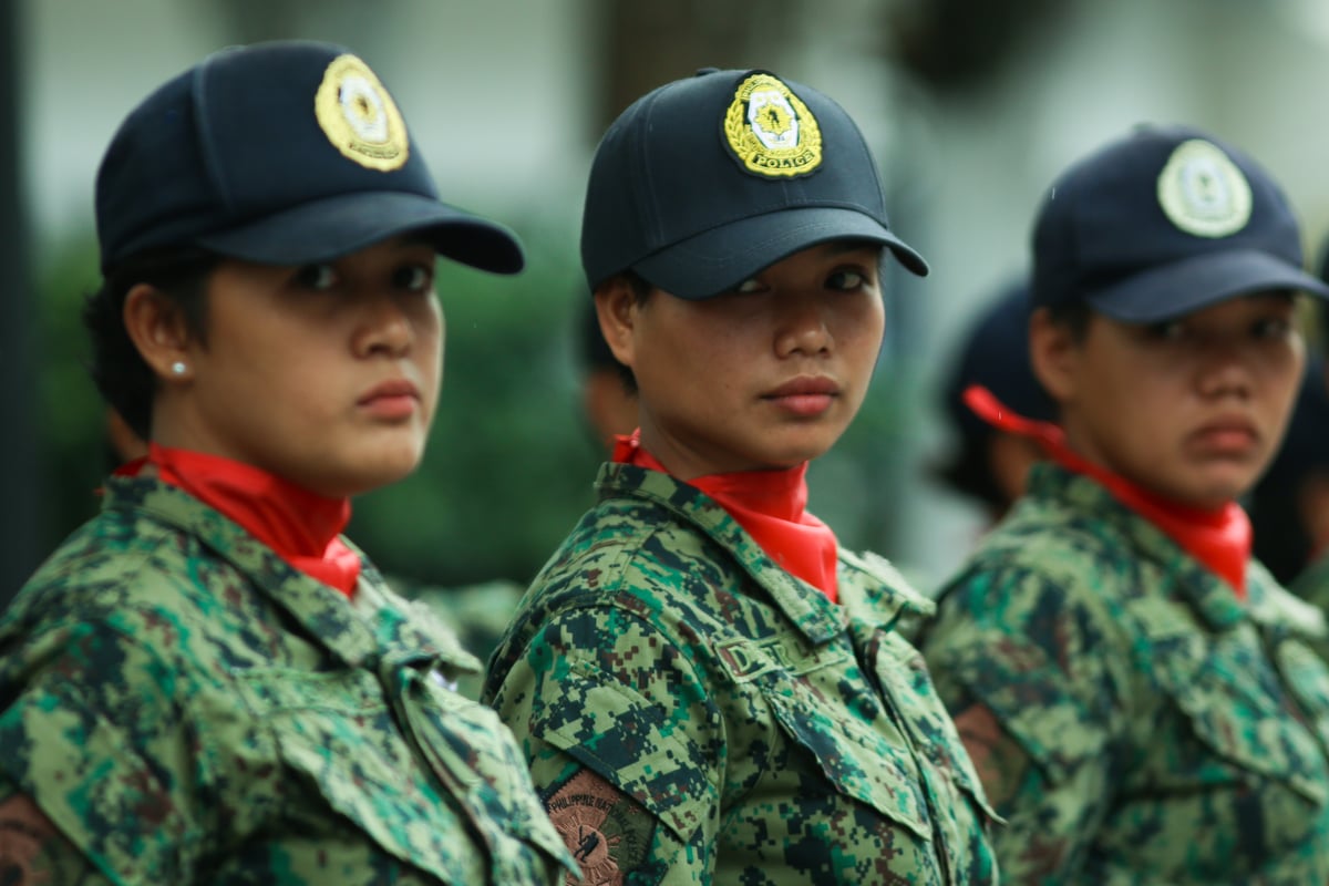 Policewomen practice as honor guards