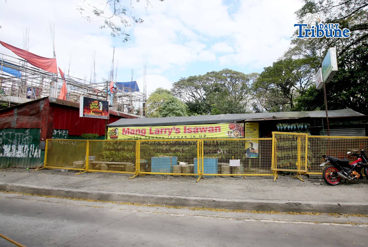 (February 21 2026) Steel barrier seen blocked at the closed main branch of the Mang Larry's Isawan along E. Jacinto Street inside the University of the Philippines Diliman Campus in Quezon City on Saturday. The iconic street food stall has closed down after 50 years following a Quezon City court ordered the closure of the establishment requiring the owner, Laurencio Convencido Jr., to pay P47,500 for "unpaid rental arrears" since October 2021 and "use and occupation of the property" as stated in the civil case won by the university. Photo/Analy Labor
