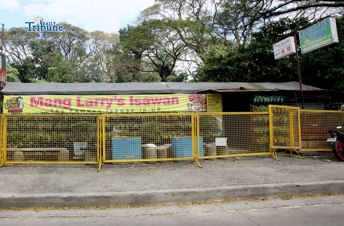 (February 21 2026) Steel barrier seen blocked at the closed main branch of the Mang Larry's Isawan along E. Jacinto Street inside the University of the Philippines Diliman Campus in Quezon City on Saturday. The iconic street food stall has closed down after 50 years following a Quezon City court ordered the closure of the establishment requiring the owner, Laurencio Convencido Jr., to pay P47,500 for "unpaid rental arrears" since October 2021 and "use and occupation of the property" as stated in the civil case won by the university. Photo/Analy Labor