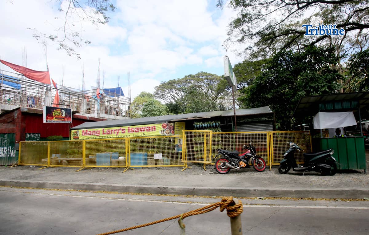 (February 21 2026) Steel barrier seen blocked at the closed main branch of the Mang Larry's Isawan along E. Jacinto Street inside the University of the Philippines Diliman Campus in Quezon City on Saturday. The iconic street food stall has closed down after 50 years following a Quezon City court ordered the closure of the establishment requiring the owner, Laurencio Convencido Jr., to pay P47,500 for "unpaid rental arrears" since October 2021 and "use and occupation of the property" as stated in the civil case won by the university. Photo/Analy Labor