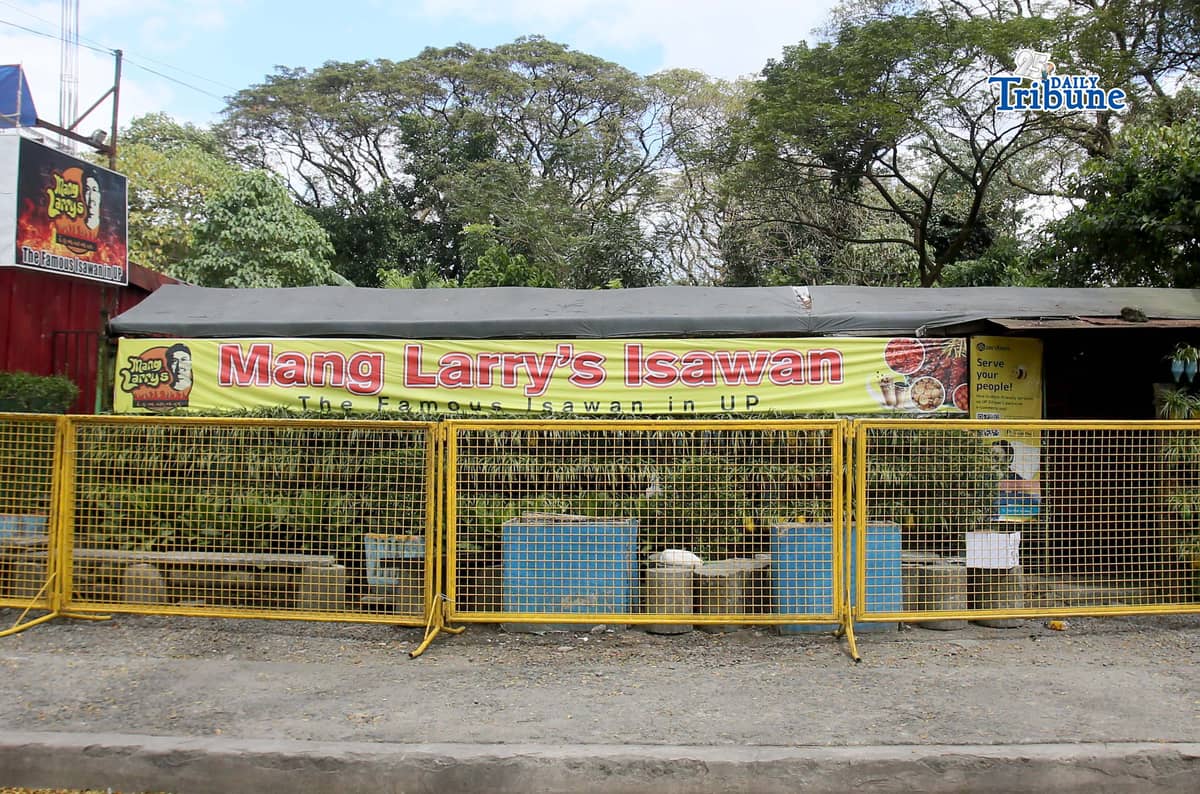(February 21 2026) Steel barrier seen blocked at the closed main branch of the Mang Larry's Isawan along E. Jacinto Street inside the University of the Philippines Diliman Campus in Quezon City on Saturday. The iconic street food stall has closed down after 50 years following a Quezon City court ordered the closure of the establishment requiring the owner, Laurencio Convencido Jr., to pay P47,500 for "unpaid rental arrears" since October 2021 and "use and occupation of the property" as stated in the civil case won by the university. Photo/Analy Labor