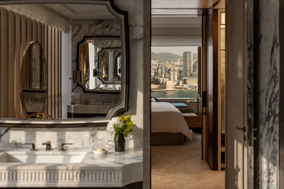 DESIGN details frame layered views of the harbour, connecting bedroom and bath in one continuous visual flow.