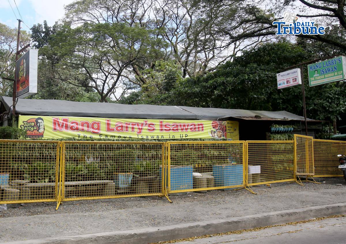 (February 21 2026) Steel barrier seen blocked at the closed main branch of the Mang Larry's Isawan along E. Jacinto Street inside the University of the Philippines Diliman Campus in Quezon City on Saturday. The iconic street food stall has closed down after 50 years following a Quezon City court ordered the closure of the establishment requiring the owner, Laurencio Convencido Jr., to pay P47,500 for "unpaid rental arrears" since October 2021 and "use and occupation of the property" as stated in the civil case won by the university. Photo/Analy Labor