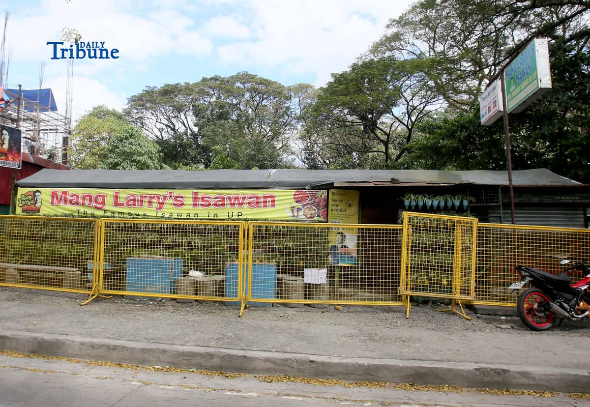 (February 21 2026) Steel barrier seen blocked at the closed main branch of the Mang Larry's Isawan along E. Jacinto Street inside the University of the Philippines Diliman Campus in Quezon City on Saturday. The iconic street food stall has closed down after 50 years following a Quezon City court ordered the closure of the establishment requiring the owner, Laurencio Convencido Jr., to pay P47,500 for "unpaid rental arrears" since October 2021 and "use and occupation of the property" as stated in the civil case won by the university. Photo/Analy Labor