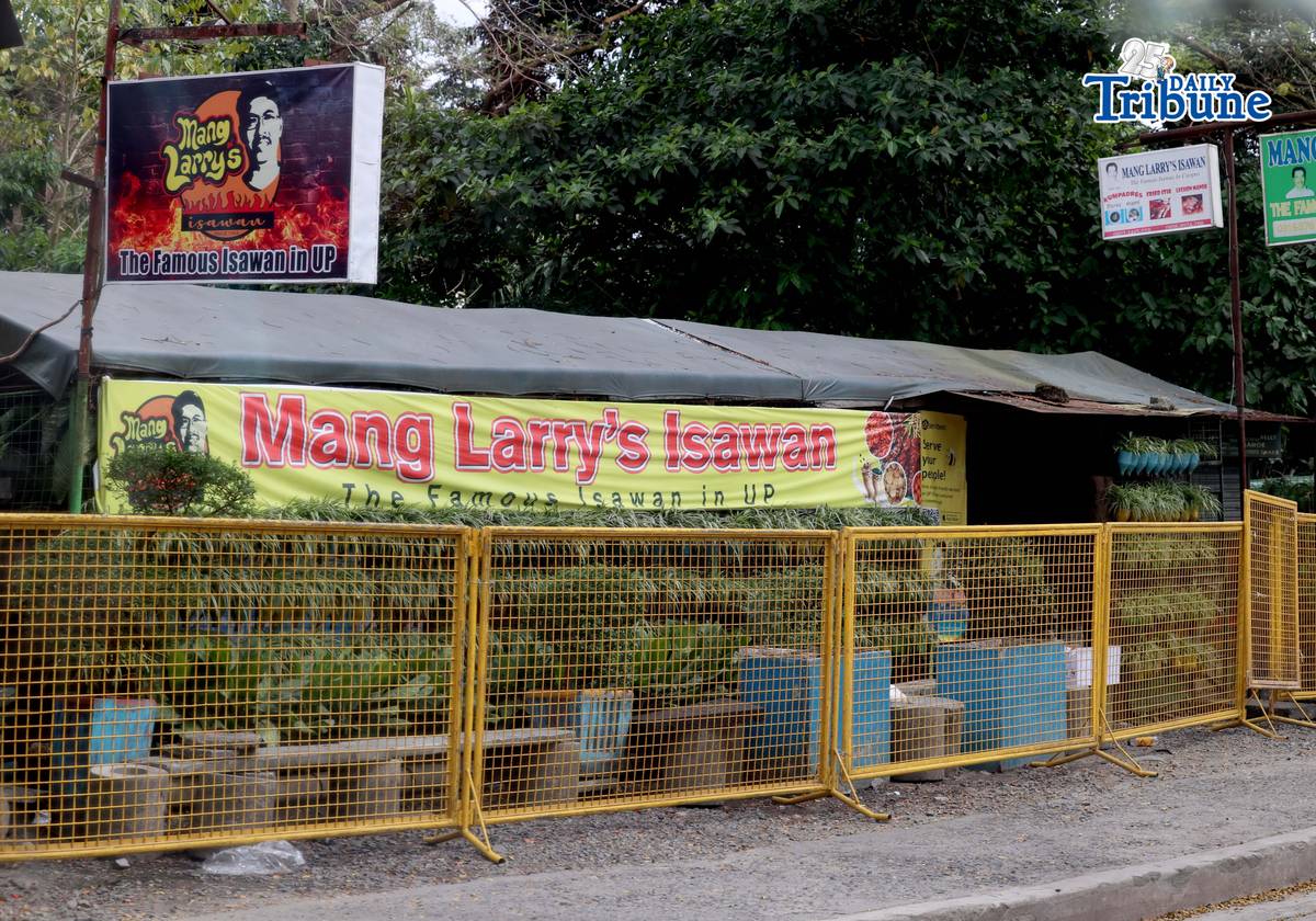 (February 21 2026) Steel barrier seen blocked at the closed main branch of the Mang Larry's Isawan along E. Jacinto Street inside the University of the Philippines Diliman Campus in Quezon City on Saturday. The iconic street food stall has closed down after 50 years following a Quezon City court ordered the closure of the establishment requiring the owner, Laurencio Convencido Jr., to pay P47,500 for "unpaid rental arrears" since October 2021 and "use and occupation of the property" as stated in the civil case won by the university. Photo/Analy Labor