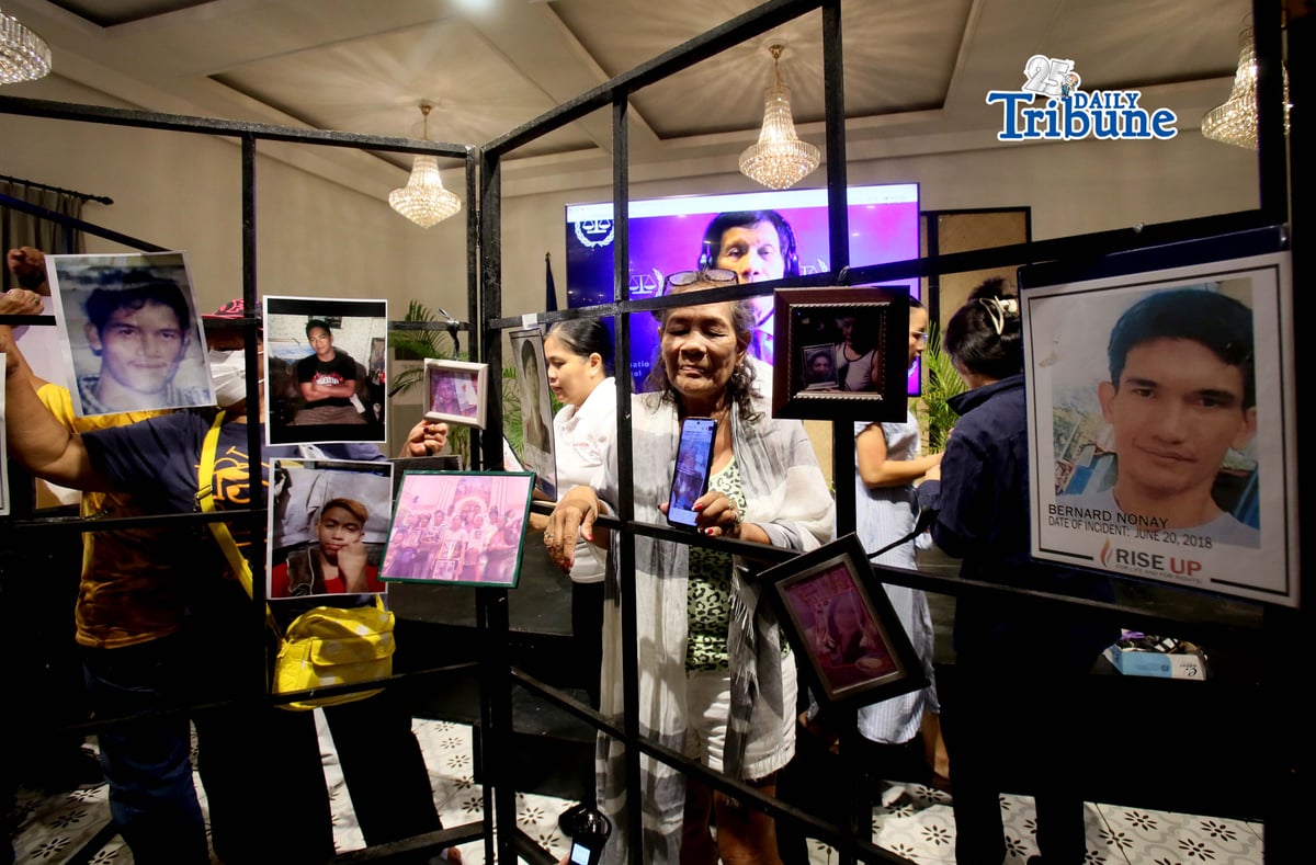 (February 23 2026) Families of the alleged EJK victims carrying the photos of their late loved ones, during the  International Criminal Court (ICC)  confirmation of charges hearing against former President Rodrigo Duterte, in his crimes against humanity case linked to the government’s anti-drug campaign, held at atencio Libunao hall in University of Philippine, diliman Quezon City, on Monday February 23 2026. Photo/Analy Labor