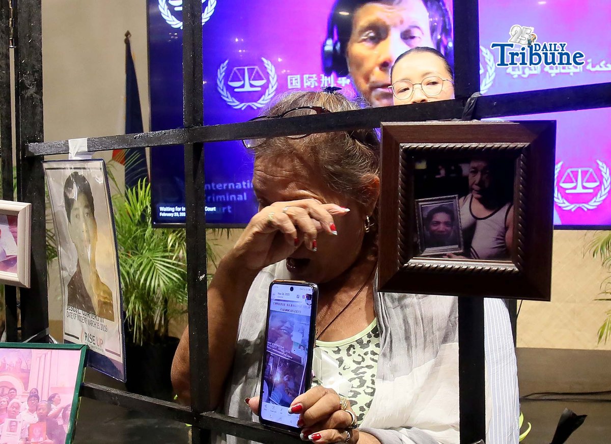 (February 23 2026) Families of the alleged EJK victims carrying the photos of their late loved ones, during the  International Criminal Court (ICC)  confirmation of charges hearing against former President Rodrigo Duterte, in his crimes against humanity case linked to the government’s anti-drug campaign, held at atencio Libunao hall in University of Philippine, diliman Quezon City, on Monday February 23 2026. Photo/Analy Labor