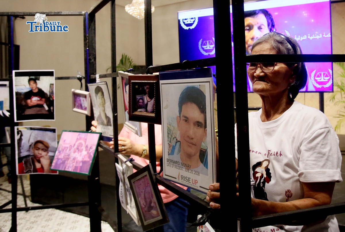 (February 23 2026) Families of the alleged EJK victims carrying the photos of their late loved ones, during the  International Criminal Court (ICC)  confirmation of charges hearing against former President Rodrigo Duterte, in his crimes against humanity case linked to the government’s anti-drug campaign, held at atencio Libunao hall in University of Philippine, diliman Quezon City, on Monday February 23 2026. Photo/Analy Labor
