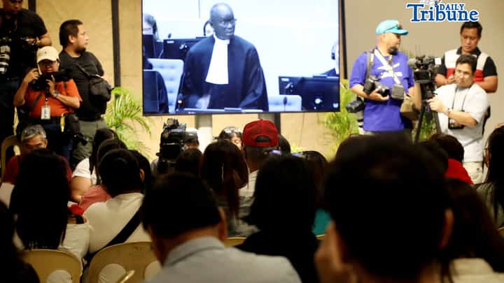 Families of the EJK victims watch the International Criminal Court (ICC) confirmation of charges hearing against former President Rodrigo Duterte in his crimes against humanity case linked to the government’s anti-drug campaign, held at Atencio Libunao Hall in the University of the Philippines, Diliman, Quezon City, on Monday, 23 February 2026.