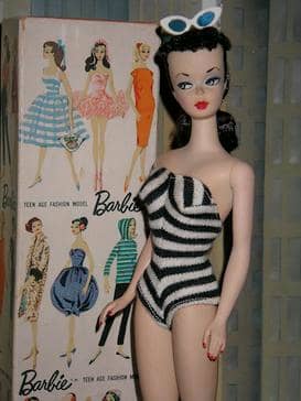 The first Barbie doll wore a black-and-white zebra striped swimsuit and her signature topknot ponytail, available in both blonde and brunette options.