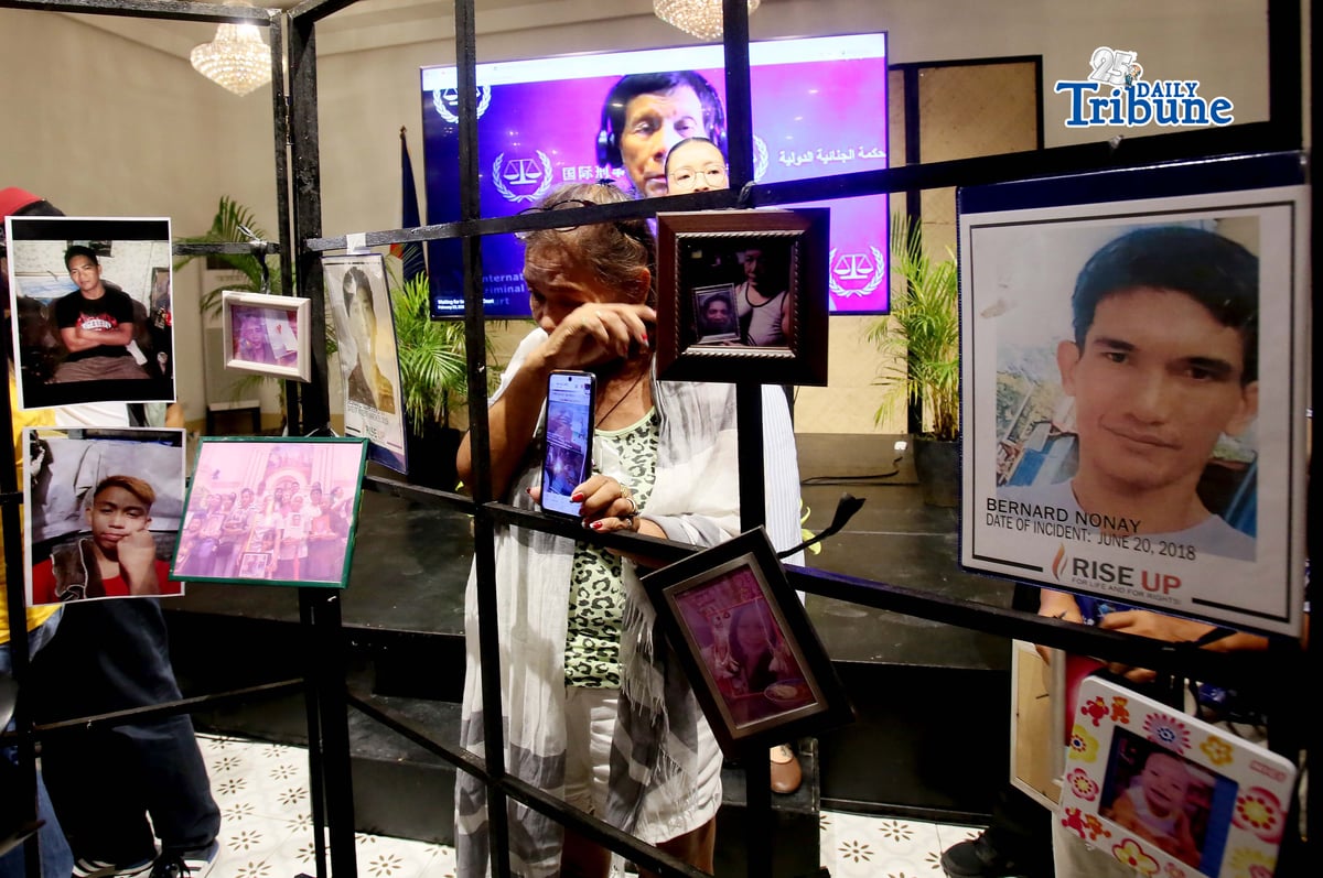 (February 23 2026) Families of the alleged EJK victims carrying the photos of their late loved ones, during the  International Criminal Court (ICC)  confirmation of charges hearing against former President Rodrigo Duterte, in his crimes against humanity case linked to the government’s anti-drug campaign, held at atencio Libunao hall in University of Philippine, diliman Quezon City, on Monday February 23 2026. Photo/Analy Labor