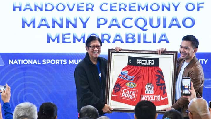 MANNY Pacquiao hands over a piece of historic memorabilia to President Ferdinand ‘Bongbong’ Marcos Jr., symbolizing his courage, determination and resilience both as a boxer and as a Filipino.