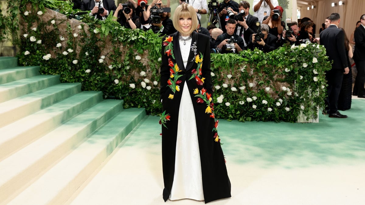 Longtime Met Gala chair Anna Wintour's long black coat with floral appliqués by the previously Jonathan Anderson-helmed Loewe was considered to be one of the best looks from the 2023 Met Gala. A stunning example of fashion as an expression of art.
