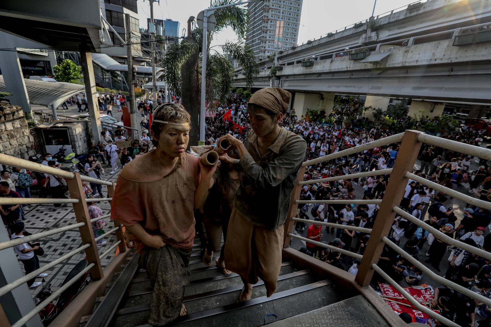 Members of the UP Repertory Company are seen to depict "taong putik" that signifies a protest for the alleged "floodgate scandal" in the Philippines. The street performance is a continues effort to spread the message about anomalies that started on the September 21, 2025 protest.