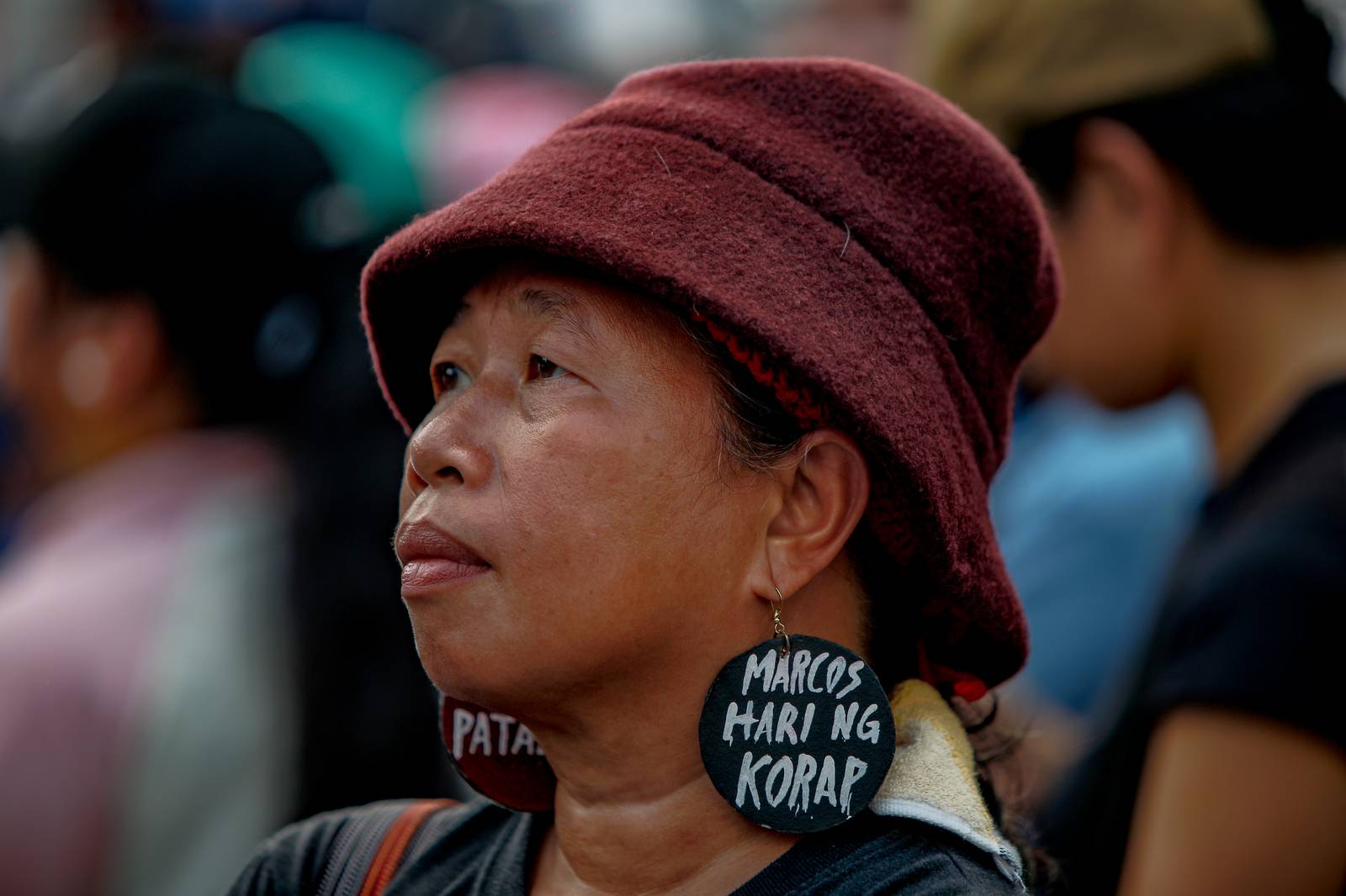 Activist Mimi Doringo seen to sport an earing that reads "Marcos is the king of corrupt."Aram Lascano