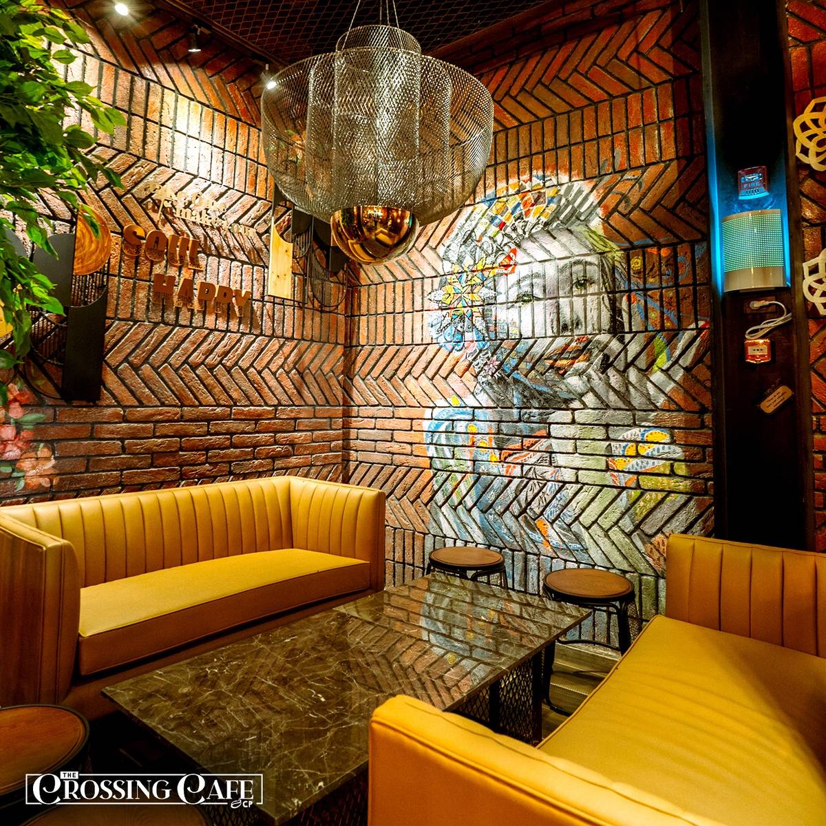 THE Crossing Cafe & Bar’s brick wall art turns heads.