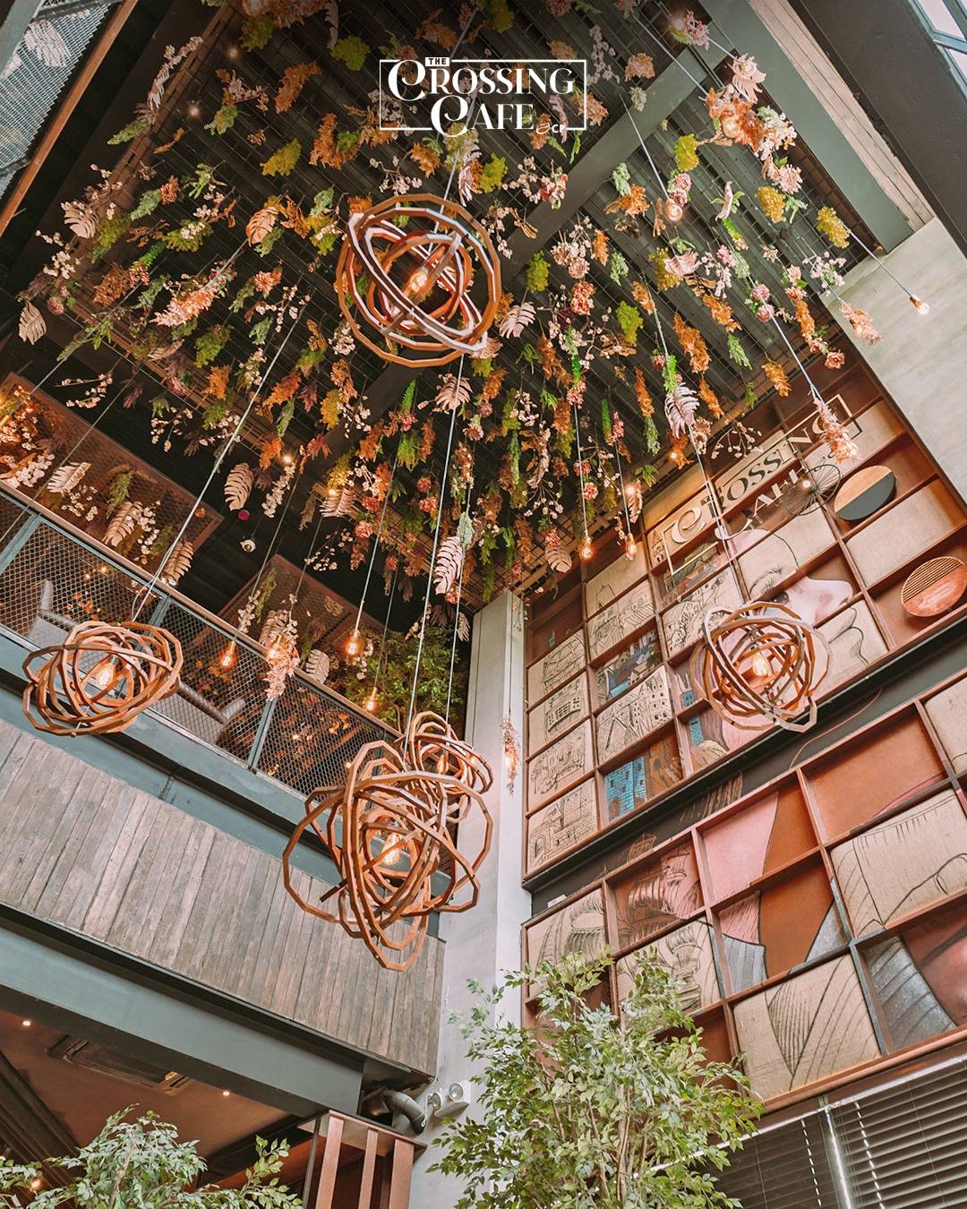 FLORAL ceiling installations with lounge-style tables.