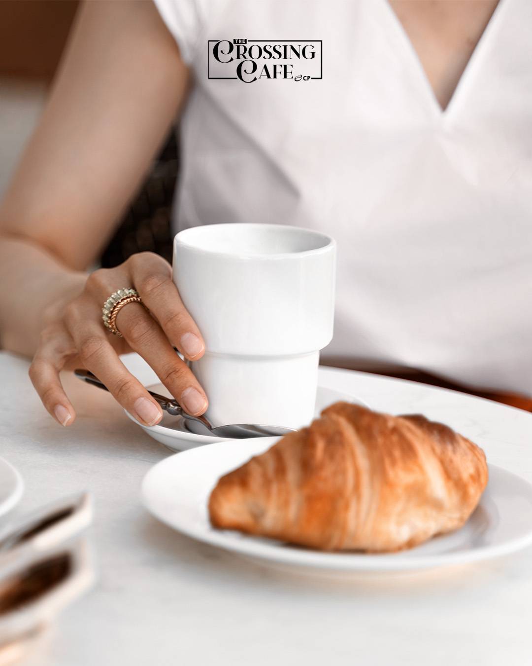 A warm cup of coffee paired with a rich tasting croissant to start the day.