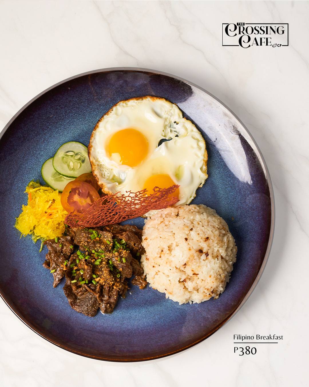 CLASSIC Filipino breakfast plate with marinated beef tapa, sinangag, sunny-side-up eggs.