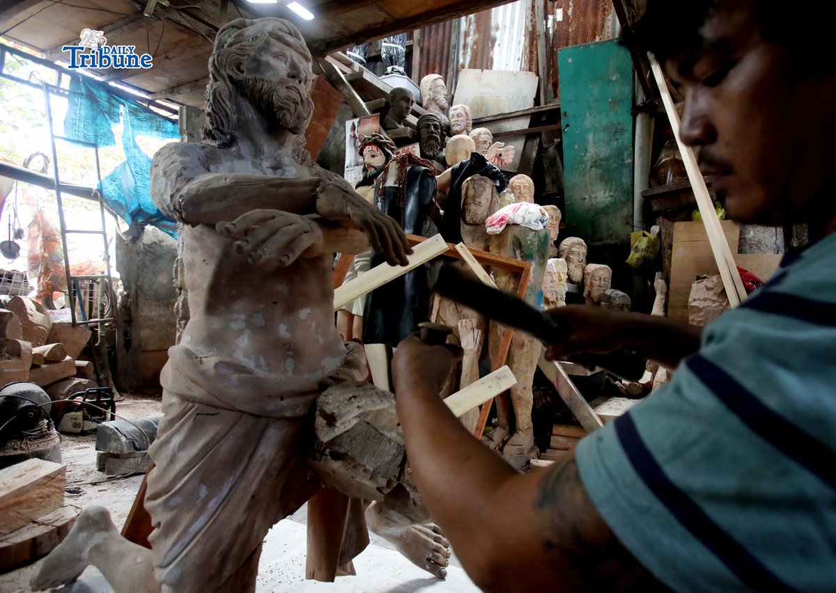 AS the Lenten season begins on Ash Wednesday, a wood sculpture artist is seen carving an image of Jesus Christ from salvaged wood in Iloilo City on Saturday, 28 February 2026.