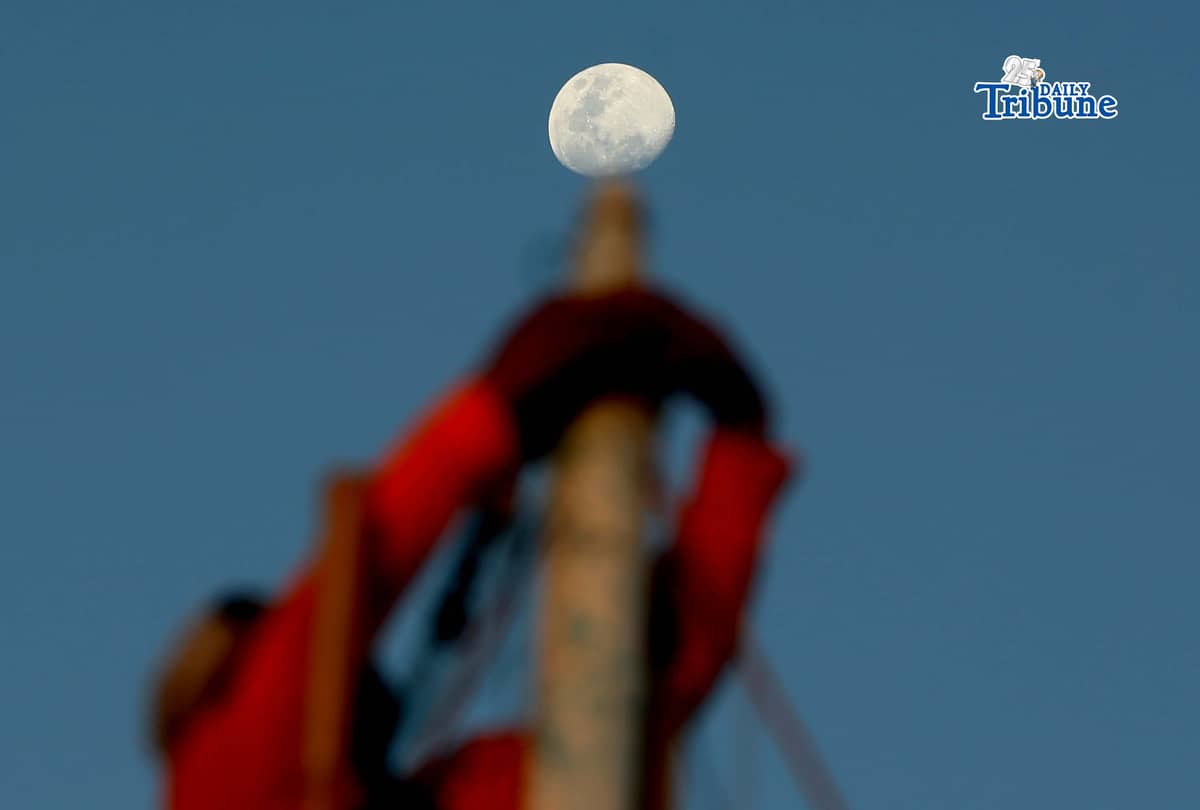 A half moon rises over the shoreline of Arevalo in Iloilo City on Saturday. A total lunar eclipse will occur on 3 March 2026 and will be fully visible in Manila, lasting about 82 minutes from 11:27 p.m. The eclipse, sometimes called a “blood moon,” occurs when the moon turns red.