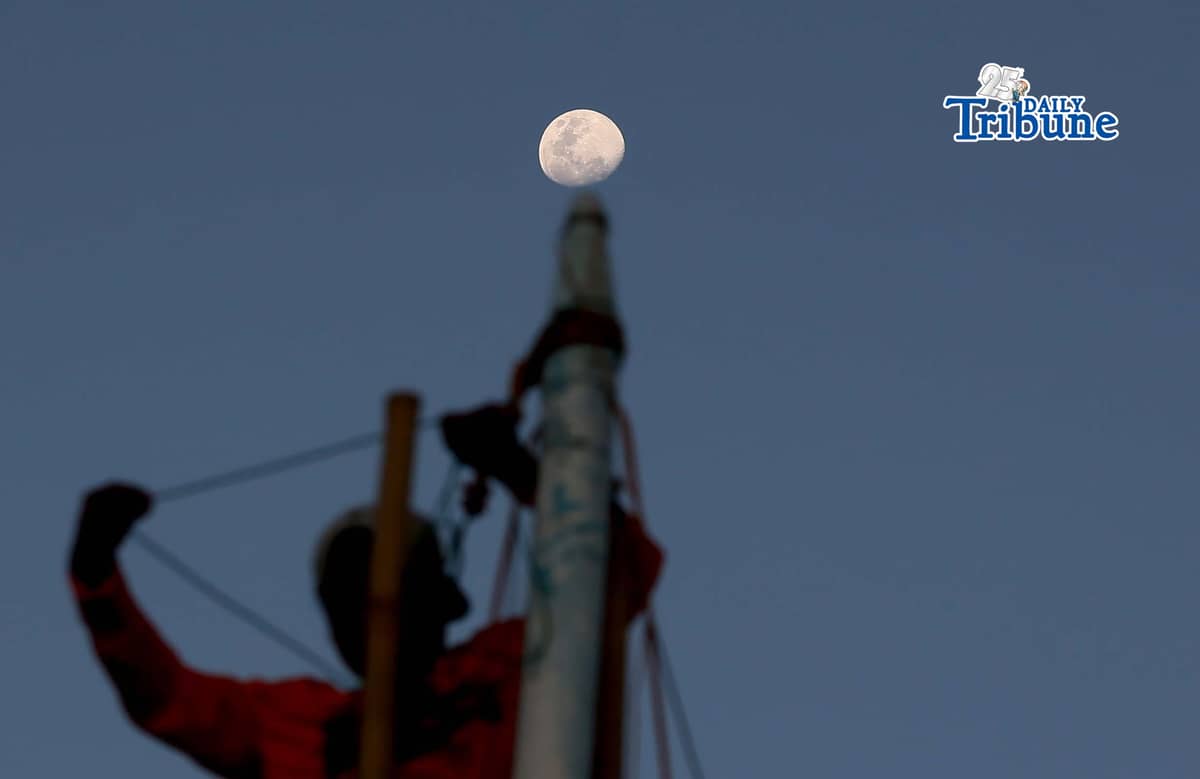 A half moon rises over the shoreline of Arevalo in Iloilo City on Saturday. A total lunar eclipse will occur on 3 March 2026 and will be fully visible in Manila, lasting about 82 minutes from 11:27 p.m. The eclipse, sometimes called a “blood moon,” occurs when the moon turns red.