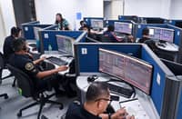 MEMBERS of the Philippine National Police man the Unified 911 system as they wait for callers. The PNP also announced that it is planning to add more female police officers to handle reports of domestic violence.
