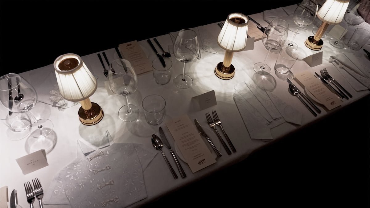 TABLE setting featuring uniquely folded napkins for each seat.