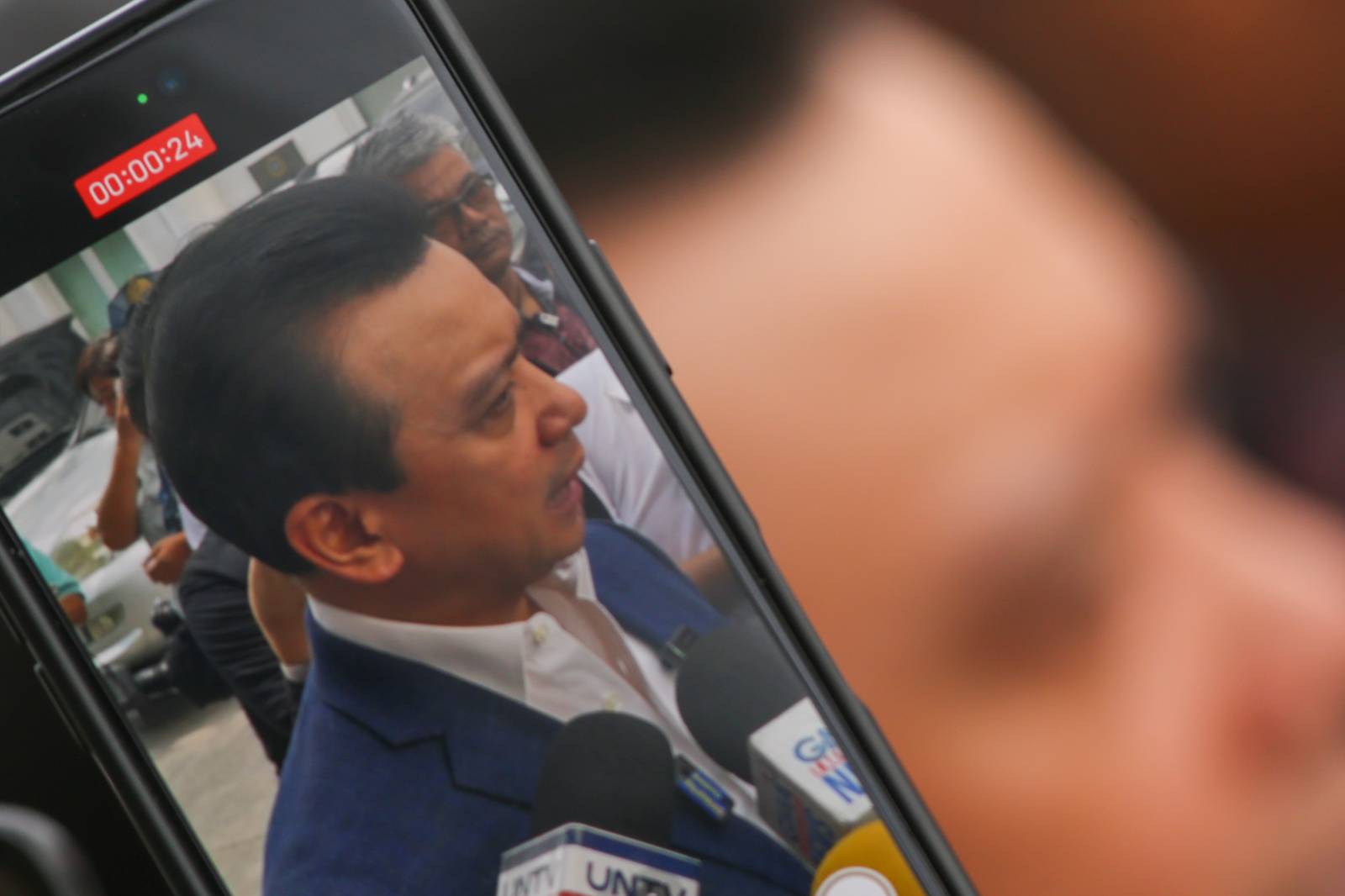 Former Senator Antonio Trillanes IV arrives at the Department of Justice in Manila on  05 March 2026, to file cyberlibel and perjury complaints against lawyer Levi Baligod and 18 "ex-marines." The complaints stem from allegations of a bribery scheme involving ICC investigators. Also named in the filing are Mike Defensor, Jay Sonza, Lorraine Badoy, and Cathy Binag for their alleged roles in spreading the claims.
