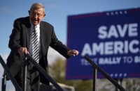 Lou Holtz leaves the stage during a rally with former U.S. President Donald Trump at the Florence Regional Airport on March 12, 2022 in Florence, South Carolina. The visit by Trump is his first rally in South Carolina since his election loss in 2020.