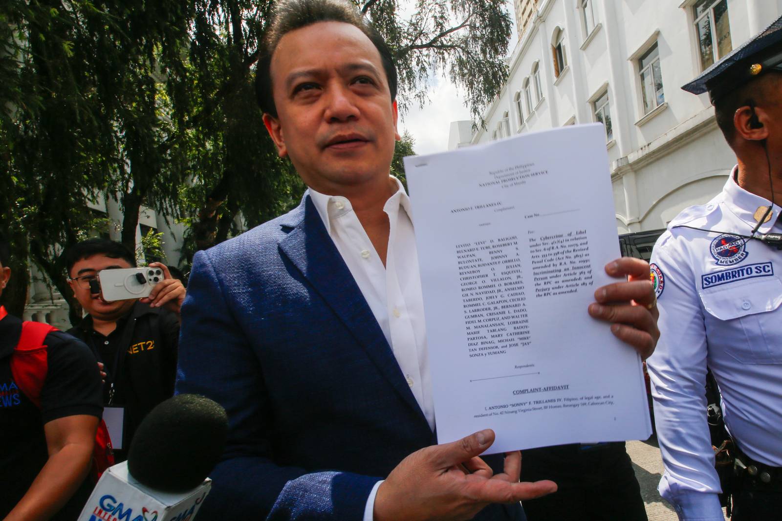 Former Senator Antonio Trillanes IV arrives at the Department of Justice in Manila on  05 March 2026, to file cyberlibel and perjury complaints against lawyer Levi Baligod and 18 "ex-marines." The complaints stem from allegations of a bribery scheme involving ICC investigators. Also named in the filing are Mike Defensor, Jay Sonza, Lorraine Badoy, and Cathy Binag for their alleged roles in spreading the claims.