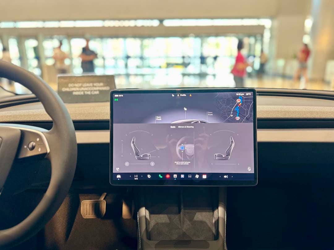 THE Model 3 has a large center touchscreen that controls navigation, climate and vehicle settings.