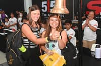 BELGIAN triathlete Lorie Verstick (left) joins Filipina Darlyn Ty in ringing the ceremonial bell during Friday’s registration for the 5150 Triathlon Guimaras.