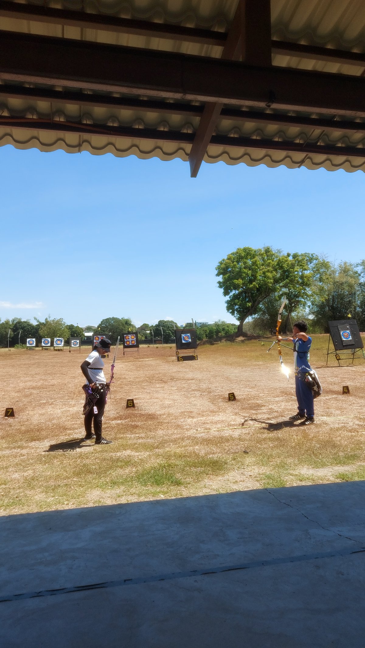 VARSITY players at the archery area.