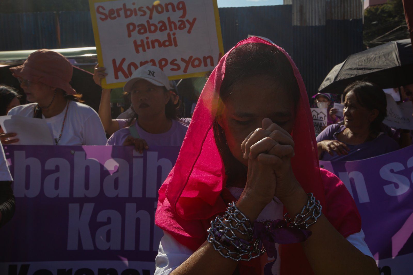 Women's rights advocates gather at Mendiola, Manila, on Saturday morning, ahead of International Women's Day, to call for decent housing for all, an end to corruption, and the demilitarization of rural areas.