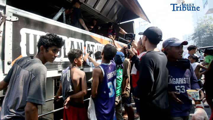 GOOD Samaritans distributed free porridge, or lugaw, to fire victims after a blaze that reached Task Force Bravo level gutted numerous houses in Barangay Pinyahan, Quezon City, on Saturday, 07 March 2026.