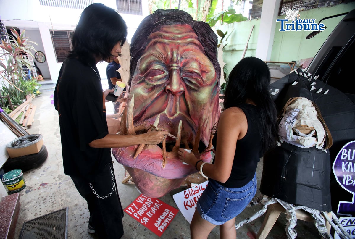 Gabriela artists finish effigy for IWD rally