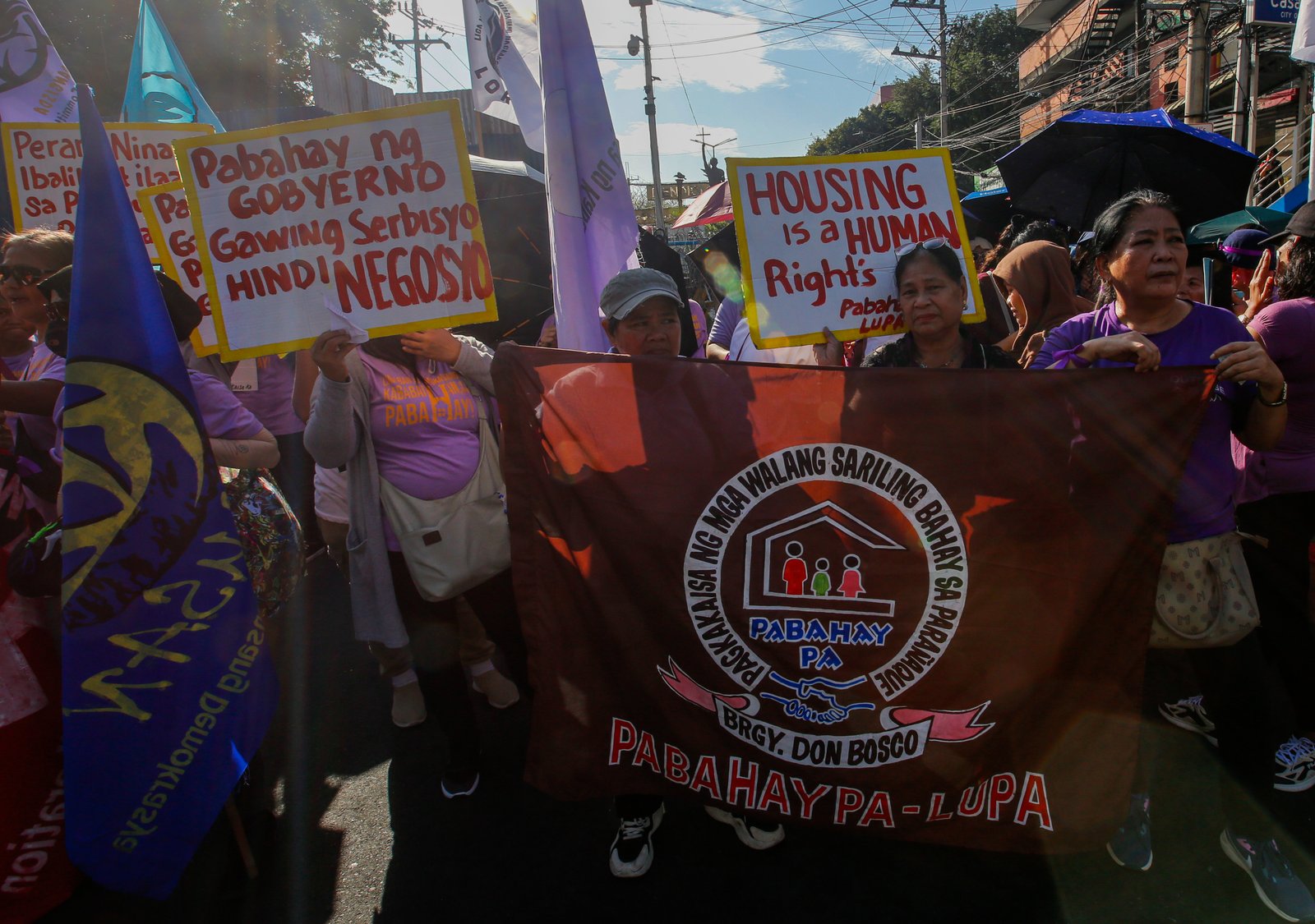 Women's rights advocates gather at Mendiola, Manila, on Saturday morning, ahead of International Women's Day, to call for decent housing for all, an end to corruption, and the demilitarization of rural areas.