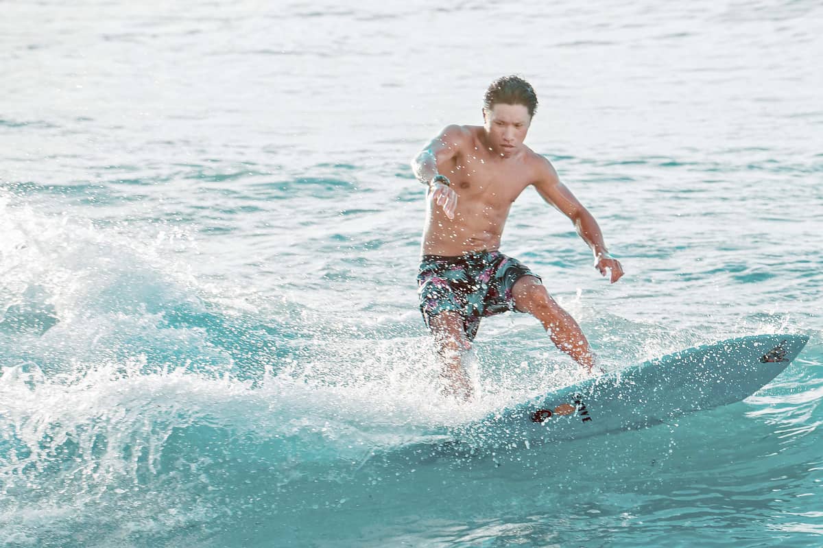 SURF A lone surfer cuts across Siargao’s rolling waves, chasing that fleeting balance between adrenaline and calm.