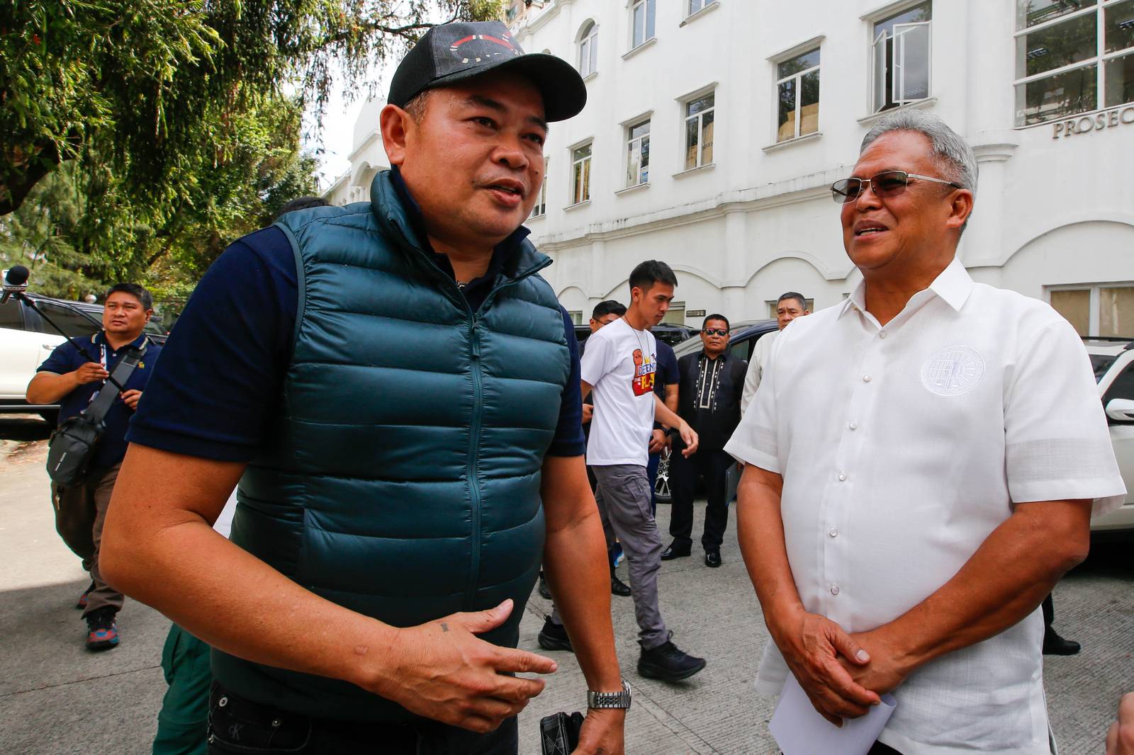 Julie "Dondon" Patidongan, a key whistleblower in the missing sabungeros case, arrives at the Department of Justice in Manila today, 09 March 2026. He remained tight-lipped regarding the reason for his visit.