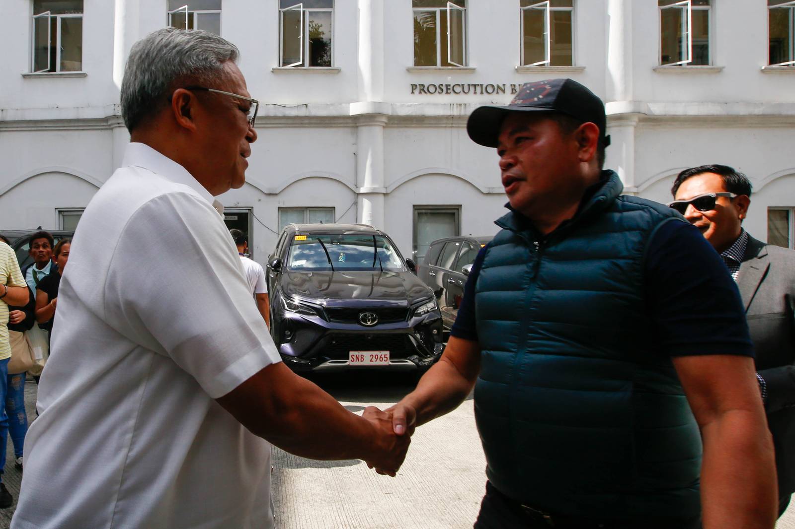 Julie "Dondon" Patidongan, a key whistleblower in the missing sabungeros case, arrives at the Department of Justice in Manila today, 09 March 2026. He remained tight-lipped regarding the reason for his visit.