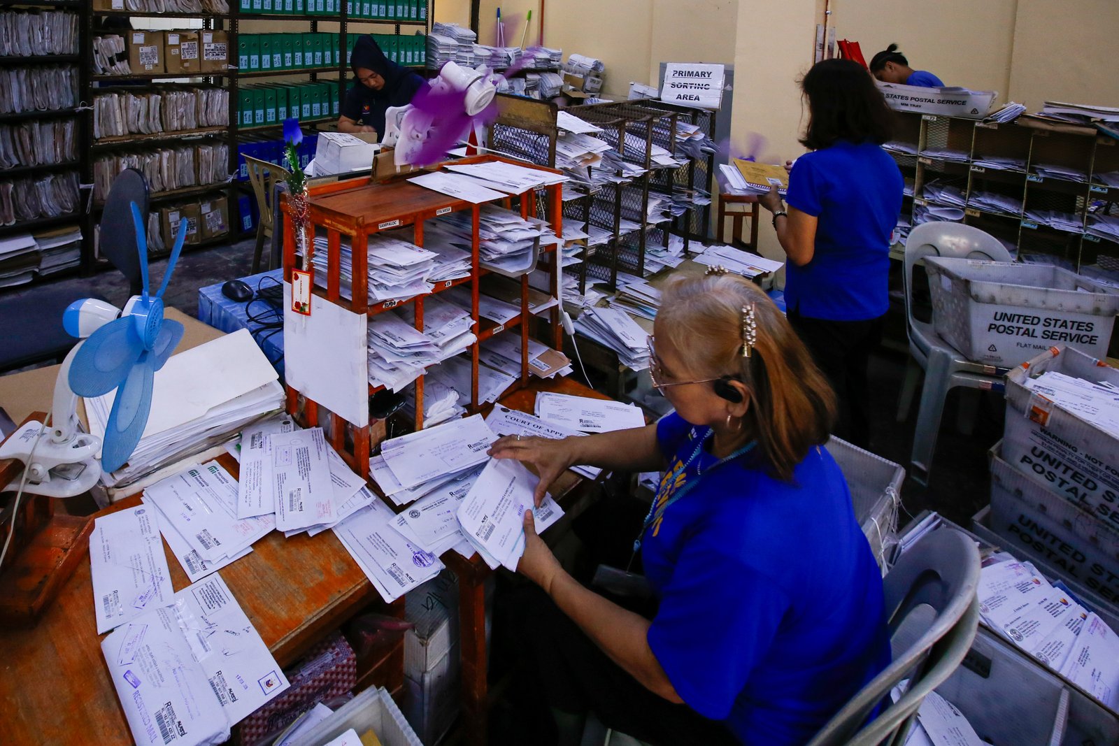 Philippine Postal Corporation (PHLPost) personnel sort mail at the Manila Central Post Office in Liwasang Bonifacio, Manila, on 09 March 2026. The PHLPost is currently implementing a compressed workweek among personnel whose duties cannot be rendered remotely and those in the mail operations to ensure uninterrupted service delivery.