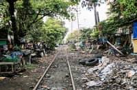 A THRIVING community stands along the abandoned train tracks in Tayuman, Manila, on 8 March. The Philippine National Railways suspended operations nearly two years ago to make way for a more modern railway system, but the project remains under construction, leaving the old tracks reclaimed by residents who have built their homes beside them.