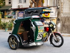 Tricycle drivers reel from historic fuel hike