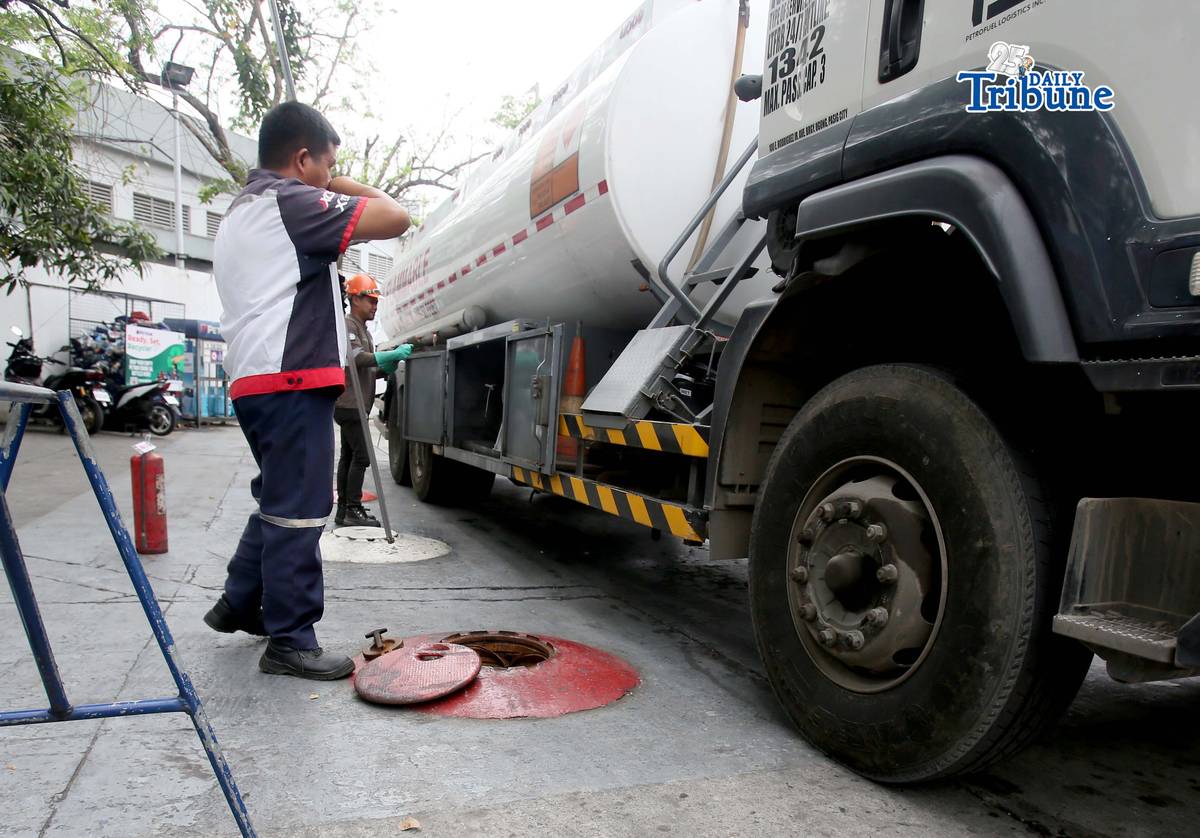 (March 11 2026) Gas attendants measure the fuel  supply in their tanks at a gasoline station along East Avenue in Quezon City on Tuesday March 10 2026, following the hike in prices by oil companies due to the on-going conflict in the Middle East. Photo/Analy Labor