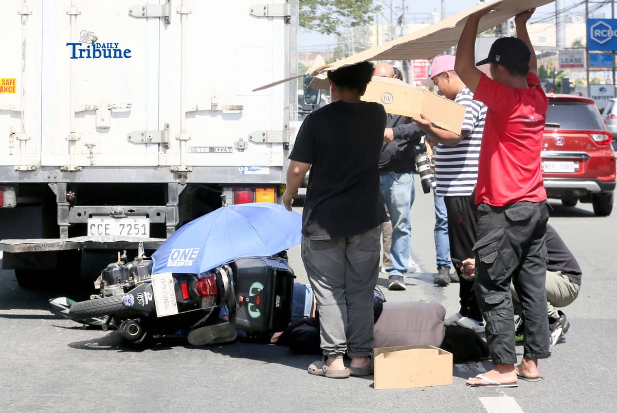 (March 11 2026) Quezon City Medics responded and rescued the accident involving a motorcycle and a closed van along Commonwealth Avenue in Quezon on Wednesday March 11 2026. Photo/Analy Labor