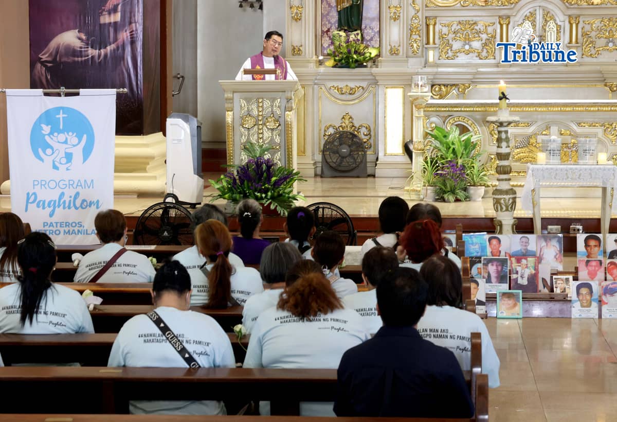 (March 11 2026) Families of EJK victims during the Duterte administration offer flowers and prayers for their departed loved ones along with photos, to mark the first anniversary of the arrest of former President Rodrigo Duterte by the International Criminal Court on Wednesday, March 11, 2026, at Sacred Heart Parish in Quezon City. Photo/Analy Labor