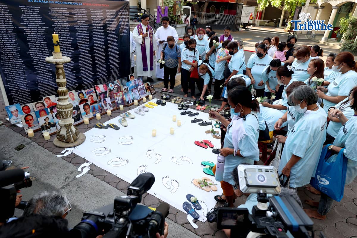 (March 11 2026) Families of EJK victims during the Duterte administration offer flowers and prayers for their departed loved ones along with photos, to mark the first anniversary of the arrest of former President Rodrigo Duterte by the International Criminal Court on Wednesday, March 11, 2026, at Sacred Heart Parish in Quezon City. Photo/Analy Labor